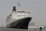 The Queen Elizabeth 2 is seen at dock as Istithmar World, the Dubai state investment company that owns the ship, outlined plans Monday to turn the retired cruise liner into a 300-room hotel, ending years of speculation about its fate, in Port Rashid, Dubai, United Arab Emirates, Monday, July 2, 2012. Britain's Queen Elizabeth II launched the QE2 in 1967.