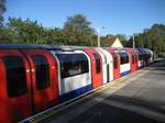 A 1992 tube stock train terminating at Loughton Station. Although electrification of this section had begun under the 1935/40 New Works Programmer (see above), the line remained steam-hauled (though from 16–27 June 1952 an experimental ACV/BUT three-car lightweight rail car set operated part of the shuttle service Monday-Friday) until 18 November 1957.