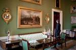 President Barack Obama looks at a mirror in the Green Room of the White House prior to an event with Community Solutions on June 30, 2009.