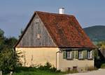 House of a day labourer in the open-air museum Beuren, Germany. The house was built in Weidenstetten, Alb-Donau-Kreis, Germany in 1734. It is constructed from field stones and uses cheap material in comparison to farmhouses.