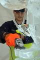 FORT LEE, Va. - Coast Guard Petty Officer 1st Class James Swenson, Food Service Quality Assurance Manager at the Coast Guard Academy in New London, Conn., uses an electric grinder to carve an ice sculpture at the 32nd Annual U.S. Army Culinary Arts Competition in Fort Lee, Va., March 14, 2007. Swenson, a food service specialist in the Coast Guard, a member of the Coast Guard team competed against chefs representing the Army, Air Force and the Marine Corps. (U.S. Coast Guard photo by Petty Office