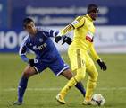 Samuel Eto'o of Anzhi Makhachkala, right, under pressure from Alexander Samedov of Dinamo Moscow during a Russian League match between Dinamo Moscow and Anzhi Makhachkala at the Khimki Arena in Moscow, Russia, Monday, March 5, 2012.