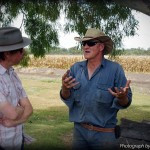 Dr Mark Bahnisch talks to farmer Ian Hayllor on his property near Dalby. Photo credit: Pandora Karavan.