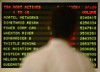  A man watches the listing for the TSX Most Active stocks in Toronto, Monday, Oct. 4, 2004. Shares of the new Air Canada (ACE Aviation) pushed higher in trading Monday, gaining more than 25 per cent from their issue price of $20. The Montreal-based airlin