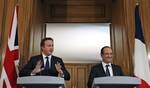 Britain's Prime Minister David Cameron, left, and French President Francois Hollande hold a news conference after their bilateral meeting at 10 Downing Street in London Tuesday July 10, 2012.