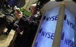 Trader Christopher Moire works on the floor of the New York Stock Exchange, Wednesday, April 7, 2010. (AP Photo/Richard Drew)