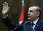 Turkey's Prime Minister Recep Tayyip Erdogan addresses lawmakers at the parliament in Ankara, Turkey, Tuesday, Jan. 26, 2010.