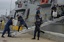 ST. PETERSBURG, Fla. (Apr. 27, 2005) Coast Guardsmen form a chain to offload 77 bales of cocaine from the CGC Tornado to Immigration and Customs Enforcement and Drug Enforcement Administration agents at Coast Guard Group St. Petersburg, Fla. The drugs and six suspected smugglers were interdicted in the Columbian Basin on April 16 by the USS Doyle with Coast Guard Law Enforcement Detachment 408 from Miami embarked and the CGC Forward. USCG photo by PA1 Danielle DeMarino (100854) ( DRUG OFFLOAD (F