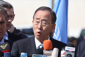 UN secretary general Ban Ki-moon waves during a visit to the construction site of a housing project in Khan Yunis in the southern Gaza Strip on February 2, 2012. Protesters threw shoes, sand and small stones at the convoy of UN chief Ban Ki-moon as he entered the Gaza Strip for a visit.Phoot by Ahmed Deeb/WN