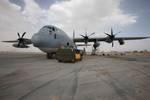 A KC-130J showing the AN/AAQ-30 Targeting Sight and AGM-114 Hellfires on the left wing in Afghanistan, 2011.