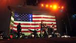 Natalie Stovall, a country music artist, and her band perform during a Navy Entertainment-sponsored concert aboard the San Antonio-class amphibious transport dock ship USS Mesa Verde (LPD 19).