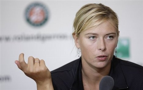 Russia's Maria Sharapova speaks during a press conference after her French Open quarterfinal defeat to Slovakia's Dominika Cibulkova at the Roland Garros stadium in Paris, Tuesday June 2, 2009