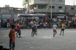 Palestinian youths playing football during a local match a little before sunset in Rafah refugee camp in the southern Gaza Strip on July 28, 2012. Palestinians organize Ramadan Olympics in conjunction with the ongoing Olympic Games in London, while Muslims around the world abstain from food, drink and sex from sunrise to sunset during Ramadan the holiest month in the Islamic calendar.Photo by Ahmed Deeb / WN