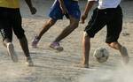 Palestinian youths playing football during a local match a little before sunset in Rafah refugee camp in the southern Gaza Strip on July 28, 2012. Palestinians organize Ramadan Olympics in conjunction with the ongoing Olympic Games in London, while Muslims around the world abstain from food, drink and sex from sunrise to sunset during Ramadan the holiest month in the Islamic calendar.Photo by Ahmed Deeb / WN