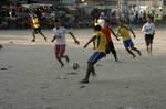 Palestinian youths playing football during a local match a little before sunset in Rafah refugee camp in the southern Gaza Strip on July 28, 2012. Palestinians organize Ramadan Olympics in conjunction with the ongoing Olympic Games in London, while Muslims around the world abstain from food, drink and sex from sunrise to sunset during Ramadan the holiest month in the Islamic calendar.Photo by Ahmed Deeb / WN