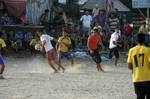 Palestinian youths playing football during a local match a little before sunset in Rafah refugee camp in the southern Gaza Strip on July 28, 2012. Palestinians organize Ramadan Olympics in conjunction with the ongoing Olympic Games in London, while Muslims around the world abstain from food, drink and sex from sunrise to sunset during Ramadan the holiest month in the Islamic calendar.Photo by Ahmed Deeb / WN