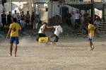 Palestinian youths playing football during a local match a little before sunset in Rafah refugee camp in the southern Gaza Strip on July 28, 2012. Palestinians organize Ramadan Olympics in conjunction with the ongoing Olympic Games in London, while Muslims around the world abstain from food, drink and sex from sunrise to sunset during Ramadan the holiest month in the Islamic calendar.Photo by Ahmed Deeb / WN