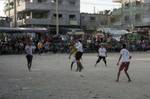 Palestinian youths playing football during a local match a little before sunset in Rafah refugee camp in the southern Gaza Strip on July 28, 2012. Palestinians organize Ramadan Olympics in conjunction with the ongoing Olympic Games in London, while Muslims around the world abstain from food, drink and sex from sunrise to sunset during Ramadan the holiest month in the Islamic calendar.Photo by Ahmed Deeb / WN