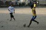 Palestinian youths playing football during a local match a little before sunset in Rafah refugee camp in the southern Gaza Strip on July 28, 2012. Palestinians organize Ramadan Olympics in conjunction with the ongoing Olympic Games in London, while Muslims around the world abstain from food, drink and sex from sunrise to sunset during Ramadan the holiest month in the Islamic calendar.Photo by Ahmed Deeb / WN