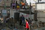 Palestinian youths playing football during a local match a little before sunset in Rafah refugee camp in the southern Gaza Strip on July 28, 2012. Palestinians organize Ramadan Olympics in conjunction with the ongoing Olympic Games in London, while Muslims around the world abstain from food, drink and sex from sunrise to sunset during Ramadan the holiest month in the Islamic calendar.Photo by Ahmed Deeb / WN