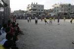 Palestinian youths playing football during a local match a little before sunset in Rafah refugee camp in the southern Gaza Strip on July 28, 2012. Palestinians organize Ramadan Olympics in conjunction with the ongoing Olympic Games in London, while Muslims around the world abstain from food, drink and sex from sunrise to sunset during Ramadan the holiest month in the Islamic calendar.Photo by Ahmed Deeb / WN