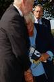 ARLINGTON, Va. (Oct. 6, 2003)--Carol Wypick, former wife of Lt. Jack Columbus Rittichier, whose remains were found in Vietnam November 2001, and laid to rest at Arlington National Cemetery, cries on her husbands shoulder during the ceremony. Rittichier , along with three other helicopter Air Force crew members, died after being shot down while attempting to rescue a U.S. Marine. USCG photo by PA1 Tom Sperduto (92553) ( RITTICHIER FUNERAL (FOR RELEASE) )