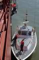 NEW YORK, New York (March. 31, 2003)--Petty Officer 2nd Class Caroll Batino, boarding officer from Coast Guard Activites New York, scales the side of a oil tanker anchored in New York Harbor Mar. 31, 2003. The Coast Guard, now part of the Department of Homeland Security, continues to board vessels in ports throughout the U.S. protecting harbors under Operation Liberty Shield from would-be terrorists. Liberty Shield is a unified operation that integrates selected national protective measures with