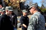 U.S. Army Maj. Gen. Lee Tafanelli, right, the Kansas adjutant general and director of the state?s Division of Emergency Management, greets Army Junior ROTC cadets in Harveyville, Kan., March 1, 2012, after an EF-2 tornado struck the area two days earlier. The storm killed one person and injured more than a dozen others as it cut a 5-mile-long path through the town. Kansas Gov. Sam Brownback visited the area to inspect the damage and meet with residents after declaring a disaster emergency in 19