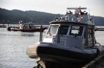 SOUTH PENDER ISLAND, British Columbia - A Royal Canadian Mounted Police 28-foot patrol boat crew prepares to get underway with a Coast Guard 33-foot Special Purpose Craft Law Enforcement boat crew in support of the Olympic Shiprider Program, Feb. 9, 2010. The Coast Guard, in partnership with the RCMP Federal Border Integrity Program, launched the Olympic Shiprider pilot program in waters off the Pacific Northwest coast to enhance security operations during the 2010 Winter Games. Marine law enfor