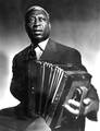 Lead Belly playing an accordion