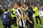 Juventus' Alessandro Del Piero and Juventus coach Antonio Conte leave the field after losing the Italian Cup soccer final with Napoli at the Olympic Stadium in Rome, Italy, Sunday, May 20, 2012.