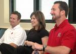 From left, University of Oklahoma head football coach Bob Stoops, RCA recording artist and American Idol winner Kelly Clarkson, and former NFL quarterback and now sports anchor for CBS 11 News in the Dallas/Fort Worth metroplex Babe Laufenberg receive their safety brief prior to taking a ride with the U.S. Navy's flight demonstration team the Blue Angels on Joint Reserve Base Naval Air Station Fort Worth, Texas, May 10, 2006. There is also a version cropped to just Kelly Clarkson.