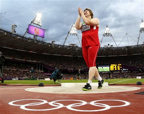 Belarus' Nadzeya Ostapchuk celebrates after winning the gold medal in the women's shot put final during the athletics in the Olympic Stadium at the 2012 Summer Olympics, London