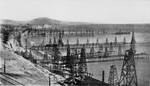 An oil field with dozens of wells. This is the Summer land Oil Field, near Santa Barbara, California, before 1906.