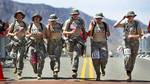 University of California Santa Barbara U.S. Army Reserve Officers' Training Corps members cross the finish line of the Bataan Memorial Death March as a team here March 25. Brandon Peer, 27, of Fort Collins, Colo., was the first ROTC participant to finish the marathon in the ROTC - heavy category, with a chip time of 5:58:28; Alexander Babos, 19, of Fort Collins, Colo., was the first ROTC - light category, with a chip time of 3:53:44.