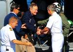 120612-N-ZZ999-001 ATLANTIC OCEAN (June 12, 2012) Former President George H.W. Bush is greeted as he arrives aboard the aircraft carrier USS George H.S. Bush (CVN 77). Bush, his wife, Barbara, their son, former President George W. Bush, and other family members toured the carrier just off the coast of Maine, where the family has a home. George H.W. Bush is the newest aircraft carrier in the fleet.