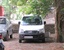 An old car standing in the building premises - automobile - vehicle