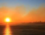 Smoke from wildfire on Angel Island blankets Downtown San Francisco, Bay Bridge, San Francisco Bay and the rising sun