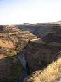 In the Palouse River Canyon just downstream of Palouse Falls, the Sentinel Bluffs flows of the Grand Ronde Formation can be seen on the bottom, covered by the Ginkgo Flow of the Wanapum Basalt.