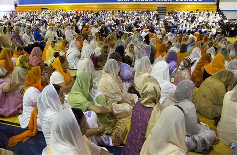 Mourners attend the funeral and memorial service for the six victims of the Sikh temple of Wisconsin mass shooting in Oak Creek, Wis., Friday, Aug 10, 2012.