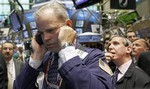 Traders David O'Day, left center, and Richard Cohen, second from right, wait for the IPO of Starwood Properties to open on the floor of the New York Stock Exchange Wednesday, Aug. 12, 2009