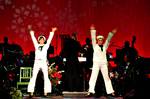 Musician 1st Class Amanda Polychronis, left, and Jennifer Stothoff act as toy sailors during the presentation of