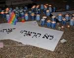 Yahrzeit candles and signs entitled 