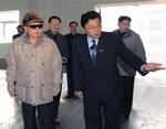 File - In this undated photo released by Korean Central News Agency via Korea News Service in Tokyo, Thursday, April 7, 2011, North Korean leader Kim Jong Il, left, along with his son Kim Jong Un, right, visit Amnokgang tire factory in Jagang Province, North Korea.