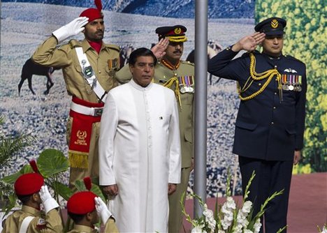 Prime Minister of Pakistan Raja Pervaiz Ashraf, in white coat, listens to national anthem on the occasion of Pakistan Independence Day in Islamabad, Pakistan Tuesday, Aug. 14, 2012.