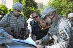 File - Katie Couric, anchor and managing editor of the CBS Evening News, speaks with Lt. Gen. Raymond T. Odierno, commander, Multinational Corps - Iraq and Col. Jeffrey Bannister, commander, 2nd Brigade Combat Team, 2nd Infantry Division, during a visit with Soldiers in the Rusafa district of Baghdad