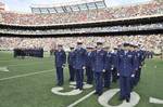 NEW YORK - Personnel from Sector New York stand at attention with other U.S. Armed Services personnel in Giants Stadium as the NFL salutes the military, Nov. 15, 2009. In the background, the Coast Guard Academy Glee Club prepares to sing the National Anthem which will kick off a game between the New York Jets and the Jacksonville Jaguars. Military personnel from all services were invited by the NFL to the game as a thank you for serving the country. U.S. Coast Guard photo by Chief Petty Officer