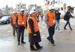 In this photo released by the Syrian official news agency SANA, Arab League monitors check Al-Sabil area, in Daraa, Syria, on Tuesday Jan.3, 2012.