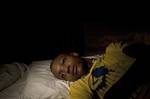 In this picture taken Sept. 3, 2011, an 18-year-old man who claims he was sexually abused by Uruguayan peacekeepers lies on his bed at his home in Port Salut, Haiti. A preliminary U.N. investigation has found no evidence for allegations that Uruguayan peacekeepers raped the 18-year-old man, Uruguay's Defense Ministry says, but the troops broke rules by having a civilian in their barracks. The alleged victim was snatched by a soldier outside the front gate of a U.N. base and was taken inside, acc