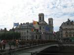 The Battant bridge with the flags of Besançon, France, and Europe, August 2007. Pont Battant: Originally this was an ancient Roman stone bridge with three arches, which unfortunately was destroyed during World War II.